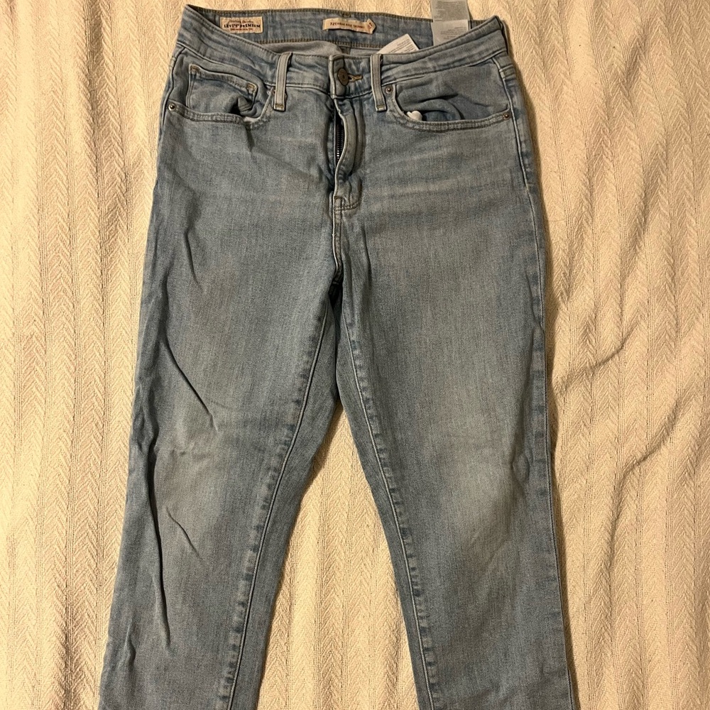 Levi’s high-rise jeans in light blue wash, size 27